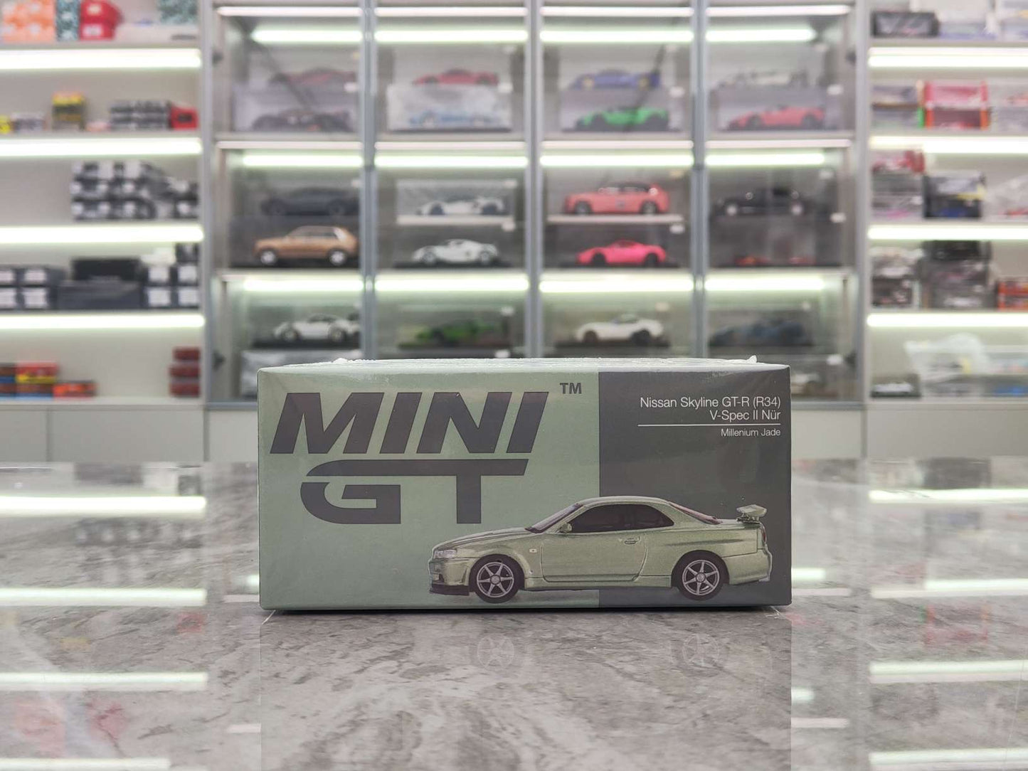 MINIGT 1/64 Nissan Skyline GT-R (R34) V-Spec II Nür Millenium Jade Kami Silver MGT01003