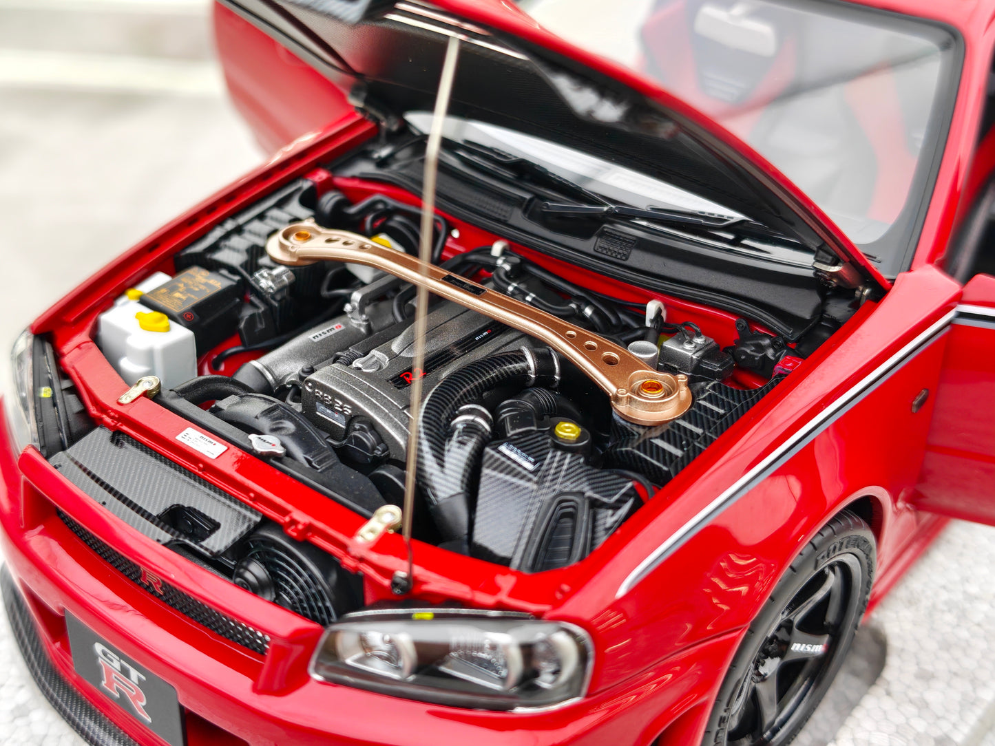 MOTORHELIX 1/18 Nissan Skyline GT-R (R34) Customized Version, Red MH328