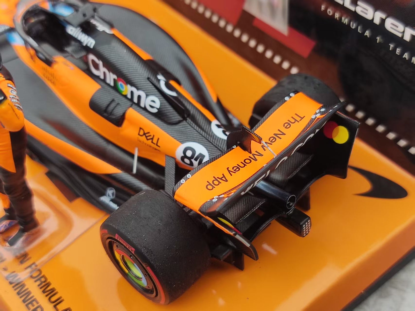 MINICHAMPS 1/43 McLaren F1 Team MCL39 - Winner Spanish GP 2025 with driver figure and scoring board, Orange 533255181