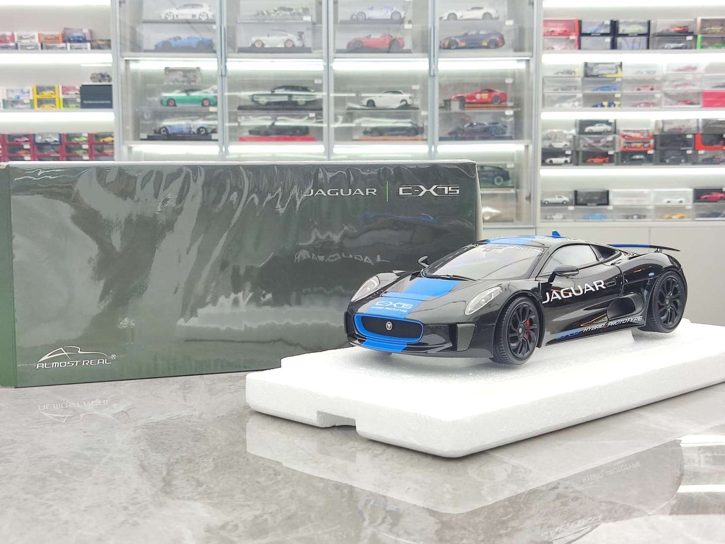 Almost Real 1/18 Jaguar C-X75 – Metallic Black with Light Blue Stripes (810603)